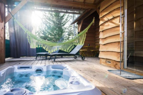 Charmante Cabane dans les arbres avec jacuzzi et sauna